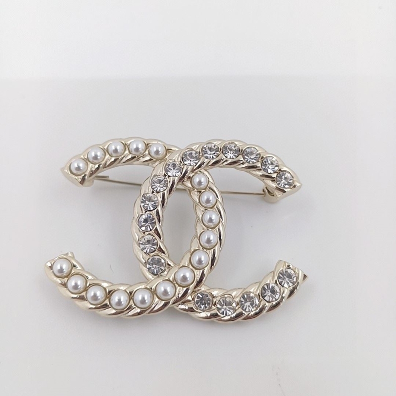 Ch*el brooches